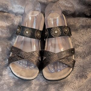 Taos Footwear Black Embossed Slip-On Sandals with Medallion Accents